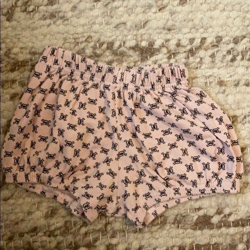 Pink bloomer shorts with skulls and bones
